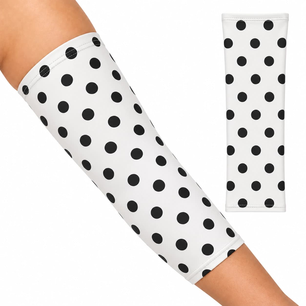 White PICC line cover with black polka dots, worn on the upper arm